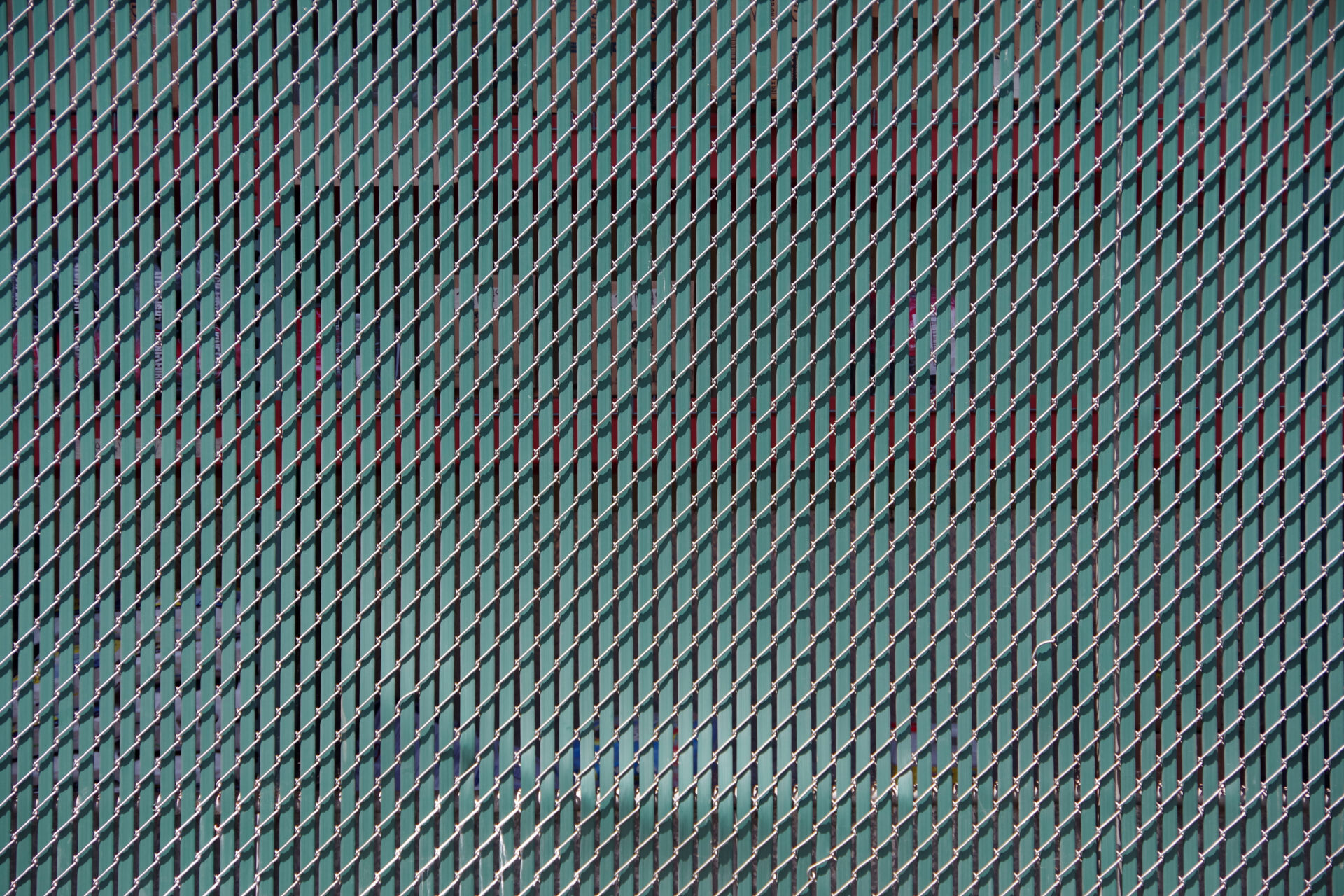 a close up of chain link fence slats